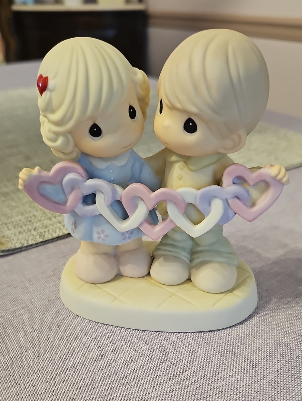 Precious Moments Boy and Girl Holding Pastel Heart Garland - Cream, Pink & Blue